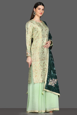 Shop beautiful mint green palazzo suit online in USA with green velvet dupatta. Dazzle on weddings and special occasions with exquisite Indian designer dresses, sharara suits, Anarkali suits from Pure Elegance Indian fashion store in USA.-right