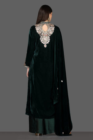 Buy gorgeous bottle green embroidered velvet palazzo suit online in USA with dupatta. Dazzle on weddings and special occasions with exquisite Indian designer lehengas, sharara suits, Anarkali suits, Indowestern dresses from Pure Elegance Indian fashion store in USA.-back