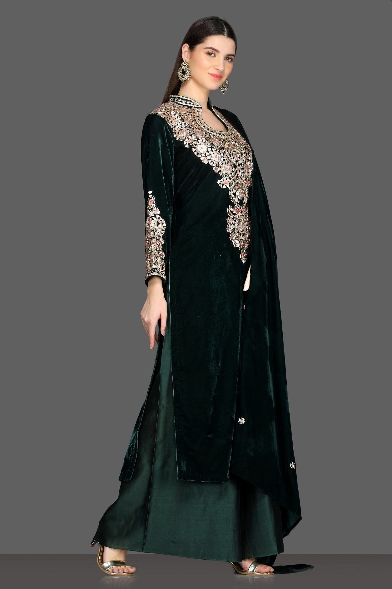 Buy gorgeous bottle green embroidered velvet palazzo suit online in USA with dupatta. Dazzle on weddings and special occasions with exquisite Indian designer lehengas, sharara suits, Anarkali suits, Indowestern dresses from Pure Elegance Indian fashion store in USA.-right