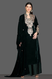 Buy gorgeous bottle green embroidered velvet palazzo suit online in USA with dupatta. Dazzle on weddings and special occasions with exquisite Indian designer lehengas, sharara suits, Anarkali suits, Indowestern dresses from Pure Elegance Indian fashion store in USA.-full view