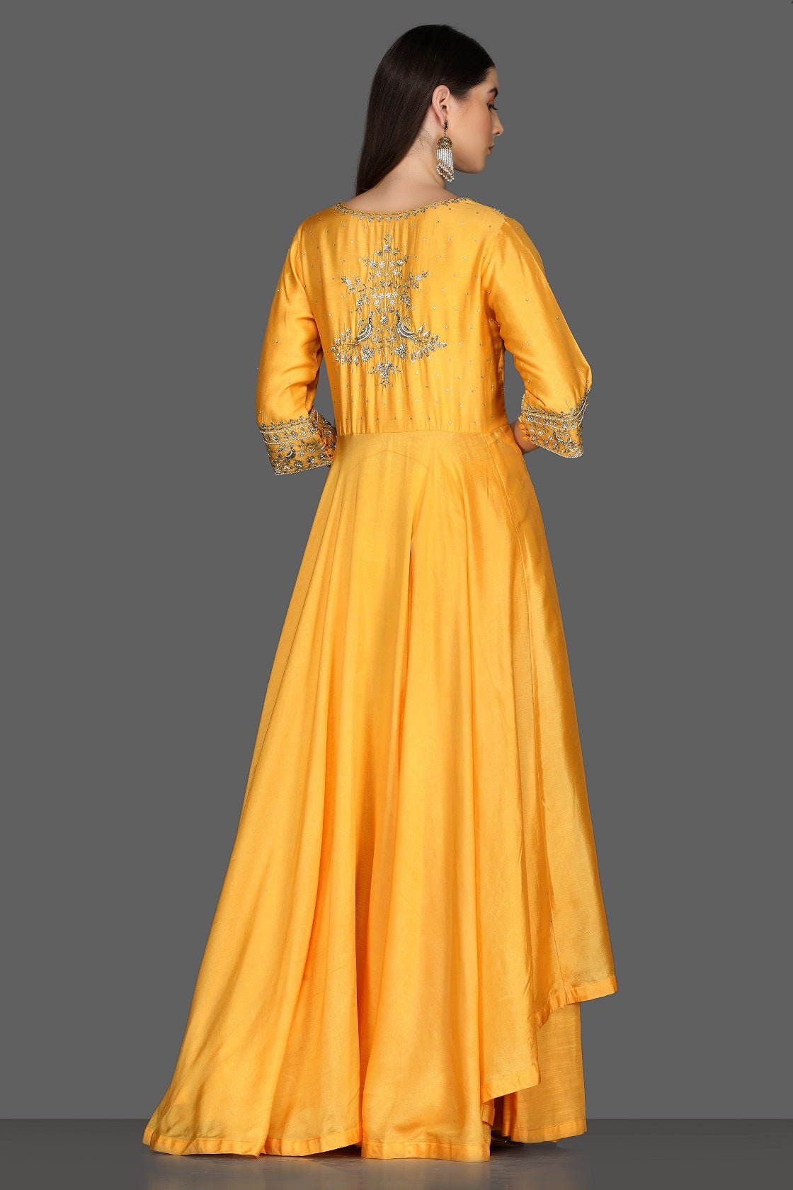 Buy yellow embroidered asymmetric palazzo suit online in USA. Dazzle on weddings and special occasions with exquisite Indian designer dresses, sharara suits, Anarkali suits from Pure Elegance Indian fashion store in USA.-back