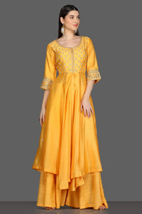 Buy yellow embroidered asymmetric palazzo suit online in USA. Dazzle on weddings and special occasions with exquisite Indian designer dresses, sharara suits, Anarkali suits from Pure Elegance Indian fashion store in USA.-full view