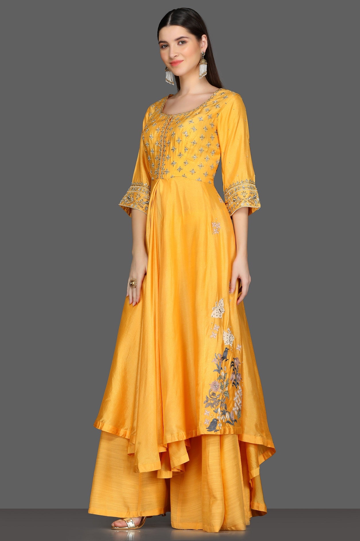 Buy yellow embroidered asymmetric palazzo suit online in USA. Dazzle on weddings and special occasions with exquisite Indian designer dresses, sharara suits, Anarkali suits from Pure Elegance Indian fashion store in USA.-left