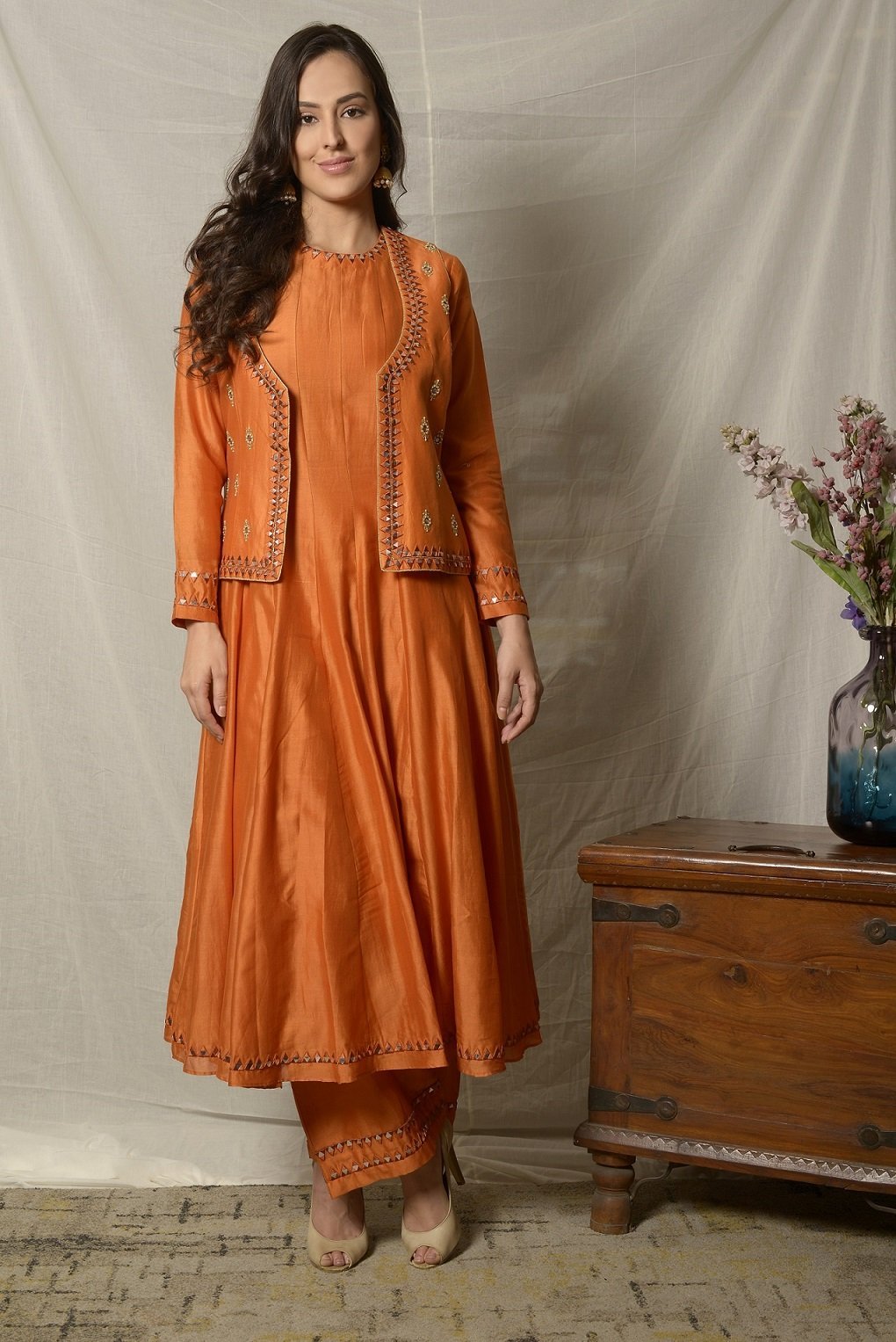 Shop gorgeous burnt orange embroidered chanderi suit with jacket online in USA and dupatta. Shine at weddings and special occasions with beautiful Indian designer suits, gowns, lehengas from Pure Elegance Indian clothing store in USA.-front with jacket