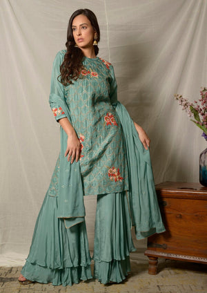 Buy gorgeous dark aqua embroidered Uppada silk suit online in USA with dupatta. Shine at weddings and special occasions with beautiful Indian designer suits, gowns, lehengas from Pure Elegance Indian clothing store in USA.-side