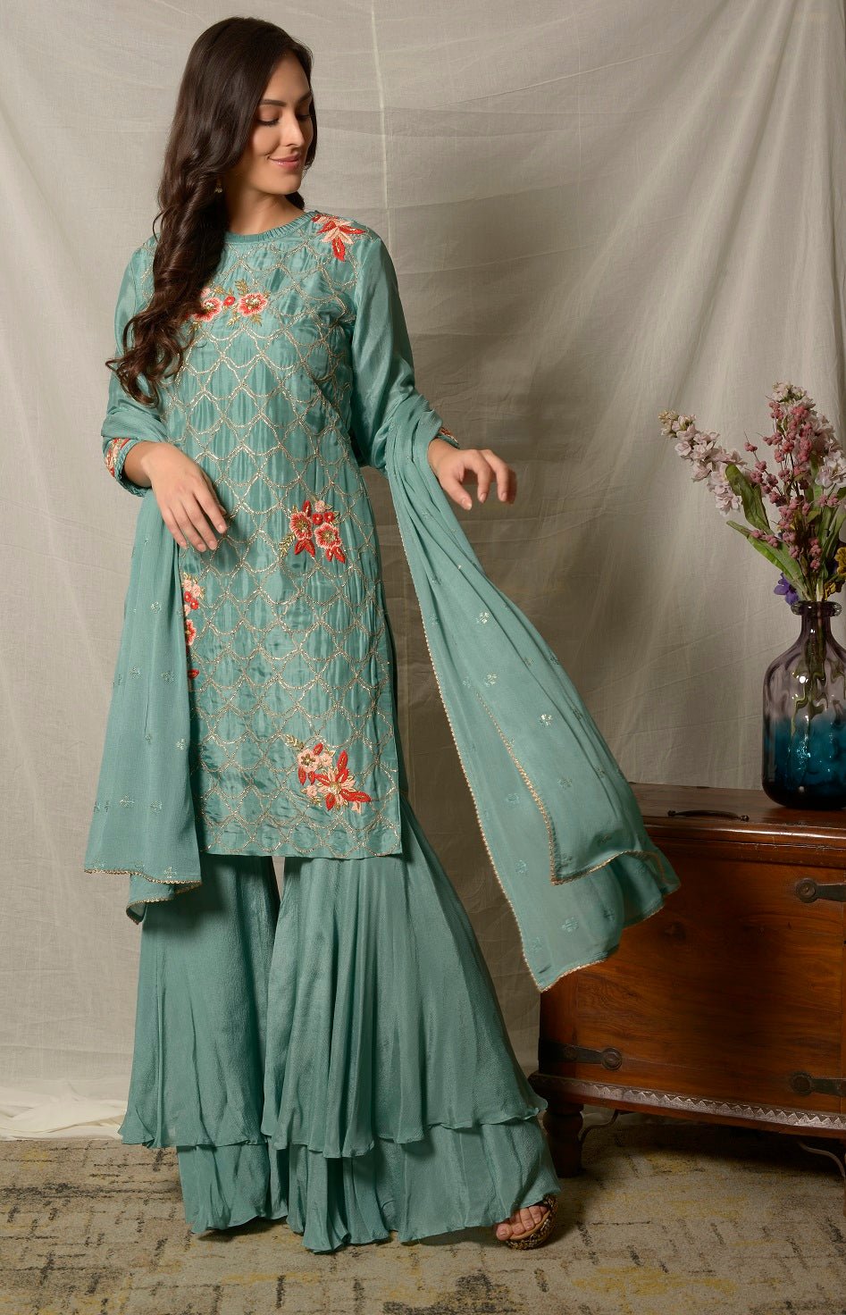 Buy gorgeous dark aqua embroidered Uppada silk suit online in USA with dupatta. Shine at weddings and special occasions with beautiful Indian designer suits, gowns, lehengas from Pure Elegance Indian clothing store in USA.-side