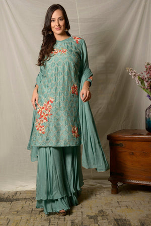 Buy gorgeous dark aqua embroidered Uppada silk suit online in USA with dupatta. Shine at weddings and special occasions with beautiful Indian designer suits, gowns, lehengas from Pure Elegance Indian clothing store in USA.-suit