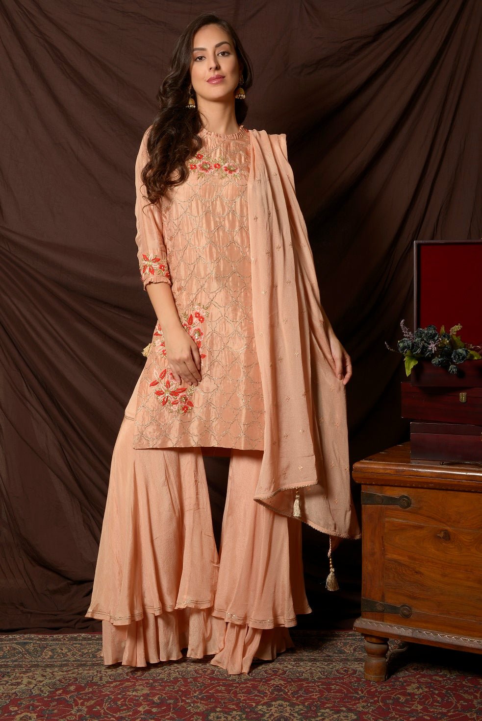 Shop beautiful peach embroidered Uppada silk suit online in USA with dupatta. Shine at weddings and special occasions with beautiful Indian designer suits, gowns, lehengas from Pure Elegance Indian clothing store in USA.-front
