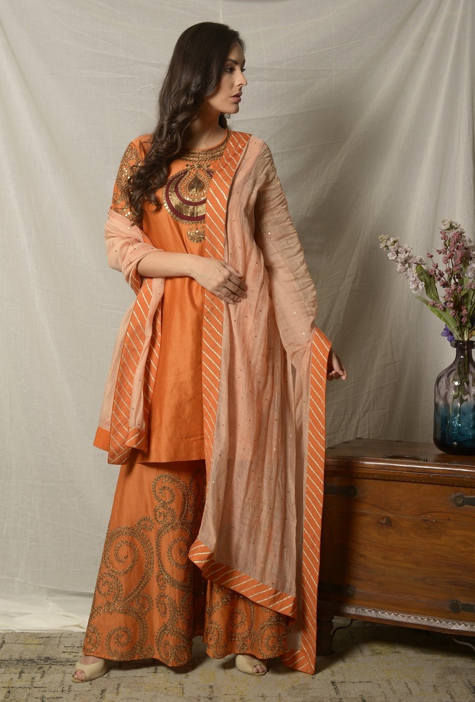 Buy stunning burnt orange embroidered chanderi sharara suit online in USA with dupatta. Shine at weddings and special occasions with beautiful Indian designer suits, gowns, lehengas from Pure Elegance Indian clothing store in USA.-sidelook