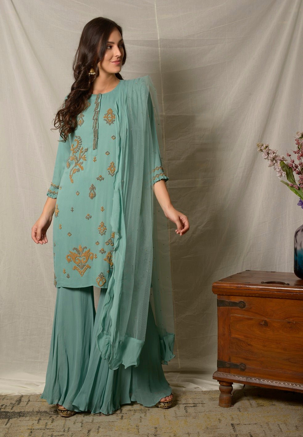 Shop elegant dark aqua embroidered georgette sharara suit online in USA with dupatta. Shine at weddings and special occasions with beautiful Indian designer suits, gowns, lehengas from Pure Elegance Indian clothing store in USA.-full view