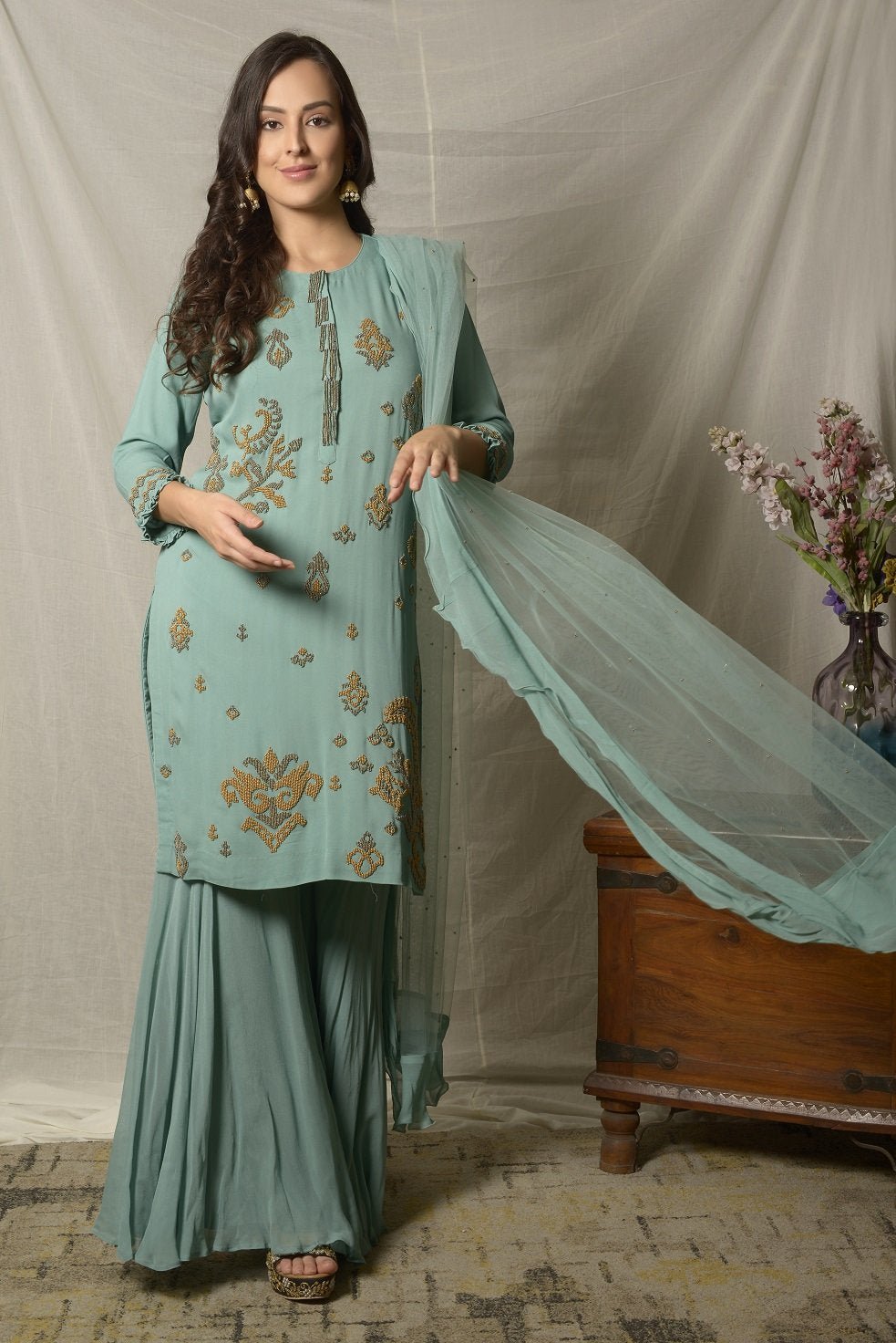 Shop elegant dark aqua embroidered georgette sharara suit online in USA with dupatta. Shine at weddings and special occasions with beautiful Indian designer suits, gowns, lehengas from Pure Elegance Indian clothing store in USA-front