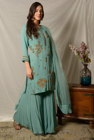 Shop elegant dark aqua embroidered georgette sharara suit online in USA with dupatta. Shine at weddings and special occasions with beautiful Indian designer suits, gowns, lehengas from Pure Elegance Indian clothing store in USA.-right