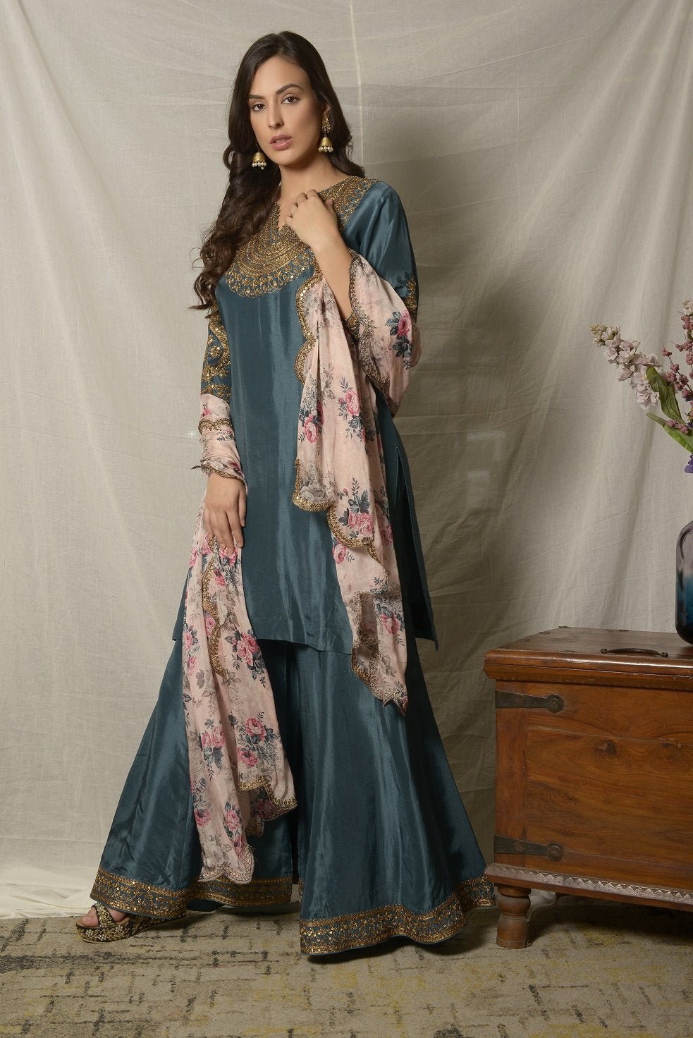 Buy beautiful teal blue embroidered Uppada silk suit online in USA with pink floral dupatta. Shine at weddings and special occasions with beautiful Indian designer suits, gowns, lehengas from Pure Elegance Indian clothing store in USA.-left side