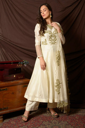 Buy gorgeous off-white embroidered Uppada silk suit online in USA with matching dupatta. Shine at weddings and special occasions with beautiful Indian designer suits, gowns, lehengas from Pure Elegance Indian clothing store in USA.-left