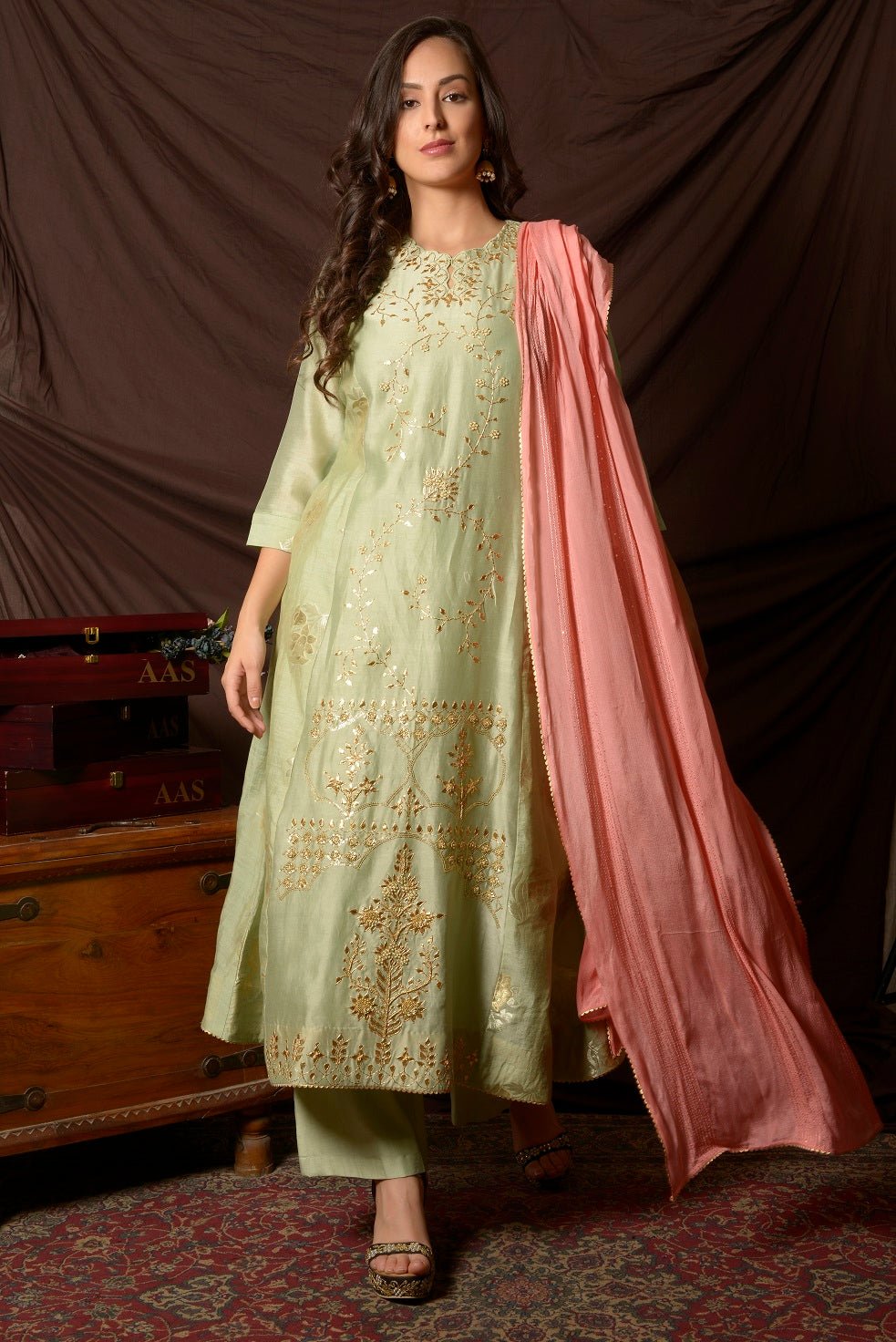 Buy gorgeous dusty green embroidered chanderi suit online in USA with pink dupatta. Shine at weddings and special occasions with beautiful Indian designer suits, gowns, lehengas from Pure Elegance Indian clothing store in USA.-front