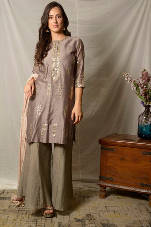 Shop elegant grey embroidered chanderi suit online in USA with dupatta and palazzo. Shine at weddings and special occasions with beautiful Indian designer suits, gowns, lehengas from Pure Elegance Indian clothing store in USA.-suit