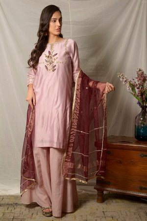 Buy alluring dull mauve gota work chanderi suit online in USA with maroon dupatta and matching palazzo. Shine at weddings and special occasions with beautiful Indian designer suits, gowns, lehengas from Pure Elegance Indian clothing store in USA.-side