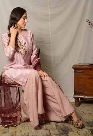 Buy alluring dull mauve gota work chanderi suit online in USA with maroon dupatta and matching palazzo. Shine at weddings and special occasions with beautiful Indian designer suits, gowns, lehengas from Pure Elegance Indian clothing store in USA.-sitting