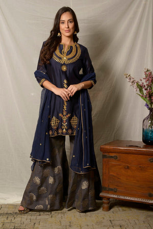 Shop gorgeous cobalt blue and grey embroidered chanderi suit online in USA with dupatta and grey palazzo. Shine at weddings and special occasions with beautiful Indian designer suits, gowns, lehengas from Pure Elegance Indian clothing store in USA.-front