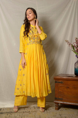Shop bright yellow embroidered cotton silk suit online in USA with dupatta. Shine at weddings and special occasions with beautiful Indian designer suits, gowns, lehengas from Pure Elegance Indian clothing store in USA.-suit