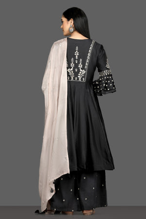 Buy elegant black embroidered flared palazzo suit online in USA with dusty pink dupatta. Dazzle on weddings and special occasions with exquisite Indian designer dresses, sharara suits, Anarkali suits, bridal lehegas from Pure Elegance Indian fashion store in USA.-back