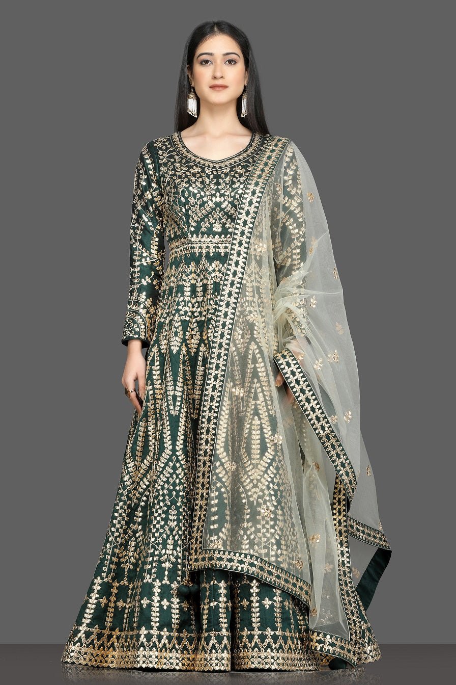 Shop beautiful dark green gota work Anarkali online in USA with net dupatta. Dazzle on weddings and special occasions with exquisite Indian designer dresses, sharara suits, Anarkali suits, bridal lehegas from Pure Elegance Indian fashion store in USA.-full view