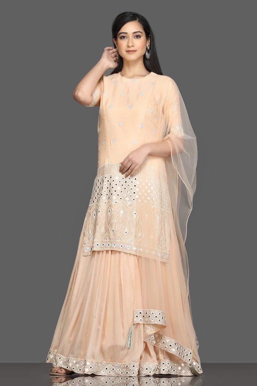 Shop elegant peach embroidered lehenga online in USA with dupatta. Dazzle on weddings and special occasions with exquisite Indian designer dresses, sharara suits, Anarkali suits, bridal lehengas from Pure Elegance Indian fashion store in USA.-full view