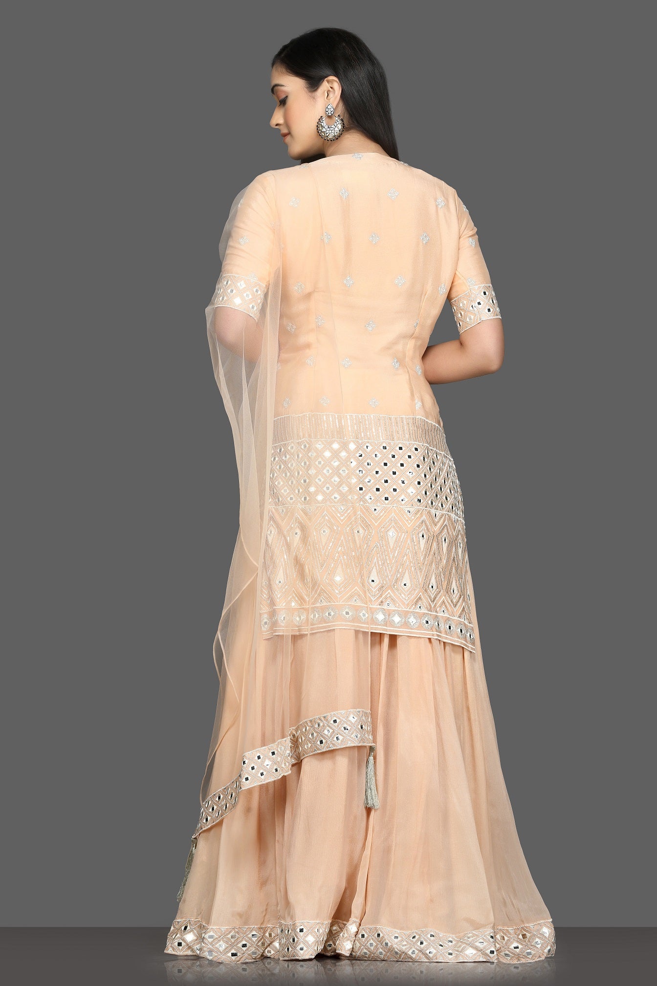 Shop elegant peach embroidered lehenga online in USA with dupatta. Dazzle on weddings and special occasions with exquisite Indian designer dresses, sharara suits, Anarkali suits, bridal lehengas from Pure Elegance Indian fashion store in USA.-back