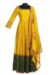 Buy stunning yellow embroidered chanderi Anarkali online in USA with green border and matching dupatta. Shine at weddings and special occasions with beautiful Indian designer Anarkali suits, traditional salwar suits, sharara suits, designer lehengas from Pure Elegance Indian clothing store in USA.-full view