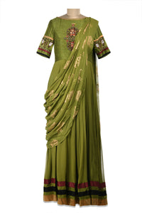 Shop beautiful green embroidered maxi dress online in USA with draped dupatta. Shine at weddings and special occasions with beautiful Indian designer Anarkali suits, traditional salwar suits, sharara suits, designer lehengas from Pure Elegance Indian clothing store in USA.-full view