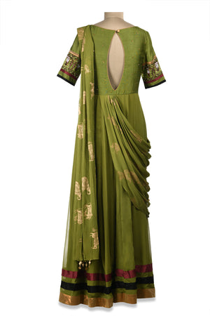 Shop beautiful green embroidered maxi dress online in USA with draped dupatta. Shine at weddings and special occasions with beautiful Indian designer Anarkali suits, traditional salwar suits, sharara suits, designer lehengas from Pure Elegance Indian clothing store in USA.-back