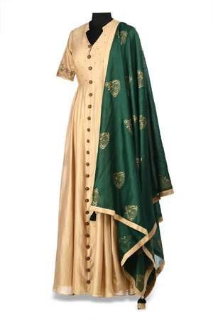 Shop elegant beige embroidered chanderi Anarkali online in USA with green block print dupatta. Shine at weddings and special occasions with beautiful Indian designer Anarkali suits, salwar suits, sharara suits, designer lehengas from Pure Elegance Indian clothing store in USA.-side