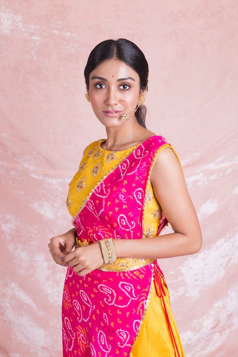 Shop stunning yellow and pink embroidered Mysore silk draped designer suit online in USA. Champion ethnic fashion on weddings and festivals with a stunning collection of designer Indian dresses, Indowestern outfits, salwar suits, Anarkali suits from Pure Elegance Indian fashion store in USA.-closeup