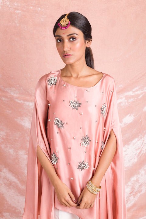 Buy lovely champagne pink embroidered satin kurta online in USA with white pants. Champion ethnic fashion on weddings and festivals with a stunning collection of designer Indian dresses, Indowestern outfits, salwar suits, Anarkali suits from Pure Elegance Indian fashion store in USA.-closeup