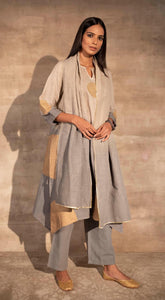 Buy stunning cream and grey linen pant suit online in USA with golden polka print. Make a fashion statement on festive occasions with designer suits, sharara suits, partywear dresses, salwar suits from Pure Elegance Indian fashion store in USA.-front