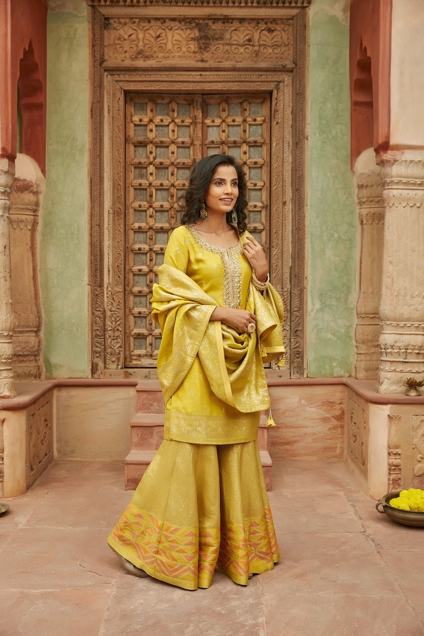 Buy stunning yellow mirror embroidery Banarasi sharara suit online in USA with dupatta. Elevate your ethnic style with a tasteful collection of designer Anarkali, designer salwar suits, designer lehengas, sharara suits from Pure Elegance Indian clothing store in USA.-full view