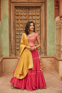 Buy beautiful pink embroidered chinnon lehenga online in USA with yellow dupatta. Elevate your ethnic style with a tasteful collection of designer Anarkali, designer salwar suits, designer lehengas, sharara suits from Pure Elegance Indian clothing store in USA.-full view