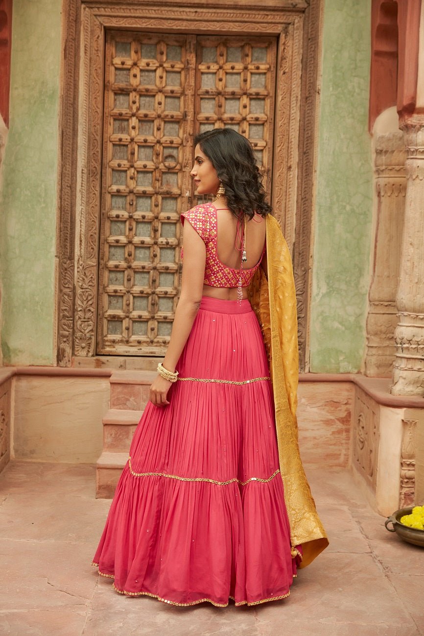 Buy beautiful pink embroidered chinnon lehenga online in USA with yellow dupatta. Elevate your ethnic style with a tasteful collection of designer Anarkali, designer salwar suits, designer lehengas, sharara suits from Pure Elegance Indian clothing store in USA.-back