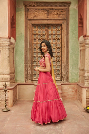 Buy beautiful pink embroidered chinnon lehenga online in USA with yellow dupatta. Elevate your ethnic style with a tasteful collection of designer Anarkali, designer salwar suits, designer lehengas, sharara suits from Pure Elegance Indian clothing store in USA.-front