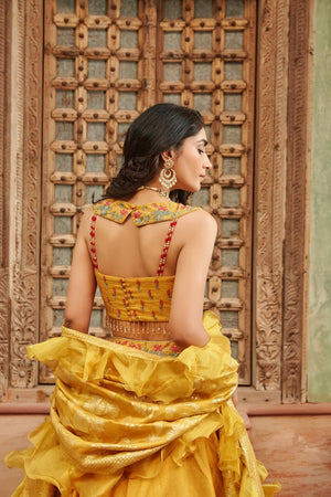 Shop gorgeous yellow embroidered raw silk lehenga online in USA with dupatta. Elevate your ethnic style with a tasteful collection of designer Anarkali, designer salwar suits, designer lehengas, sharara suits from Pure Elegance Indian clothing store in USA.-back