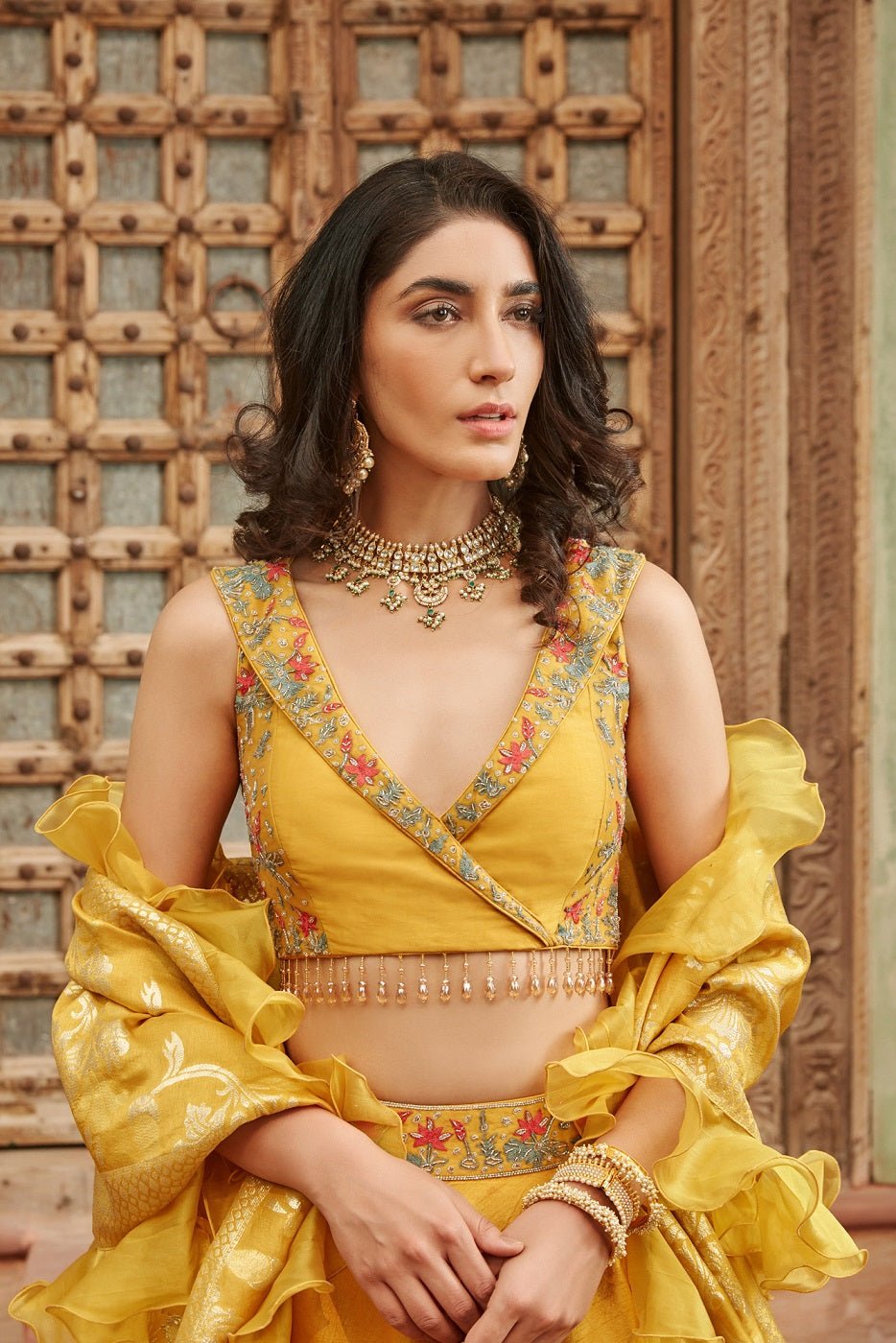 Shop gorgeous yellow embroidered raw silk lehenga online in USA with dupatta. Elevate your ethnic style with a tasteful collection of designer Anarkali, designer salwar suits, designer lehengas, sharara suits from Pure Elegance Indian clothing store in USA.-front