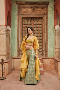 Shop beautiful yellow and green embroidered Banarasi lehenga online in USA with dupatta. Elevate your ethnic style with a tasteful collection of designer Anarkali, designer salwar suits, designer lehengas, sharara suits from Pure Elegance Indian clothing store in USA.-full view