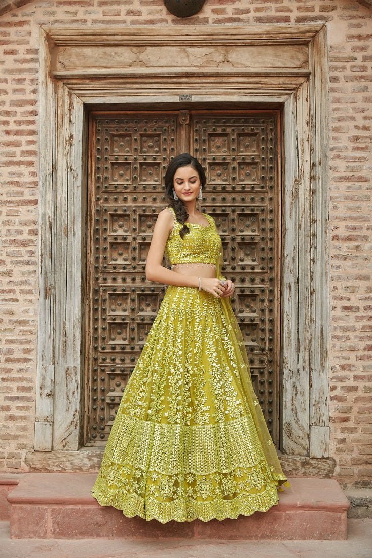 Shop beautiful light green thread embroidered net lehenga online in USA with dupatta. Elevate your ethnic style with a tasteful collection of designer Anarkali, designer salwar suits, designer lehengas, sharara suits from Pure Elegance Indian clothing store in USA.-side