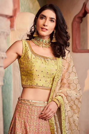 Shop stunning peach and green embroidered organza lehenga online in USA with dupatta. Elevate your ethnic style with a tasteful collection of designer Anarkali, designer salwar suits, designer lehengas, sharara suits from Pure Elegance Indian clothing store in USA.-closeup