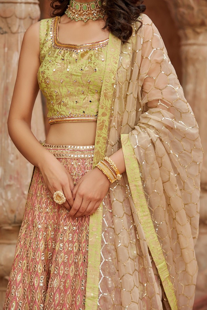 Shop stunning peach and green embroidered organza lehenga online in USA with dupatta. Elevate your ethnic style with a tasteful collection of designer Anarkali, designer salwar suits, designer lehengas, sharara suits from Pure Elegance Indian clothing store in USA.-closeup