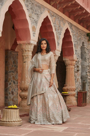 Buy stunning ivory embroidered organza lehenga online in USA with dupatta. Elevate your ethnic style with a tasteful collection of designer Anarkali, designer salwar suits, designer lehengas, sharara suits from Pure Elegance Indian clothing store in USA.-front
