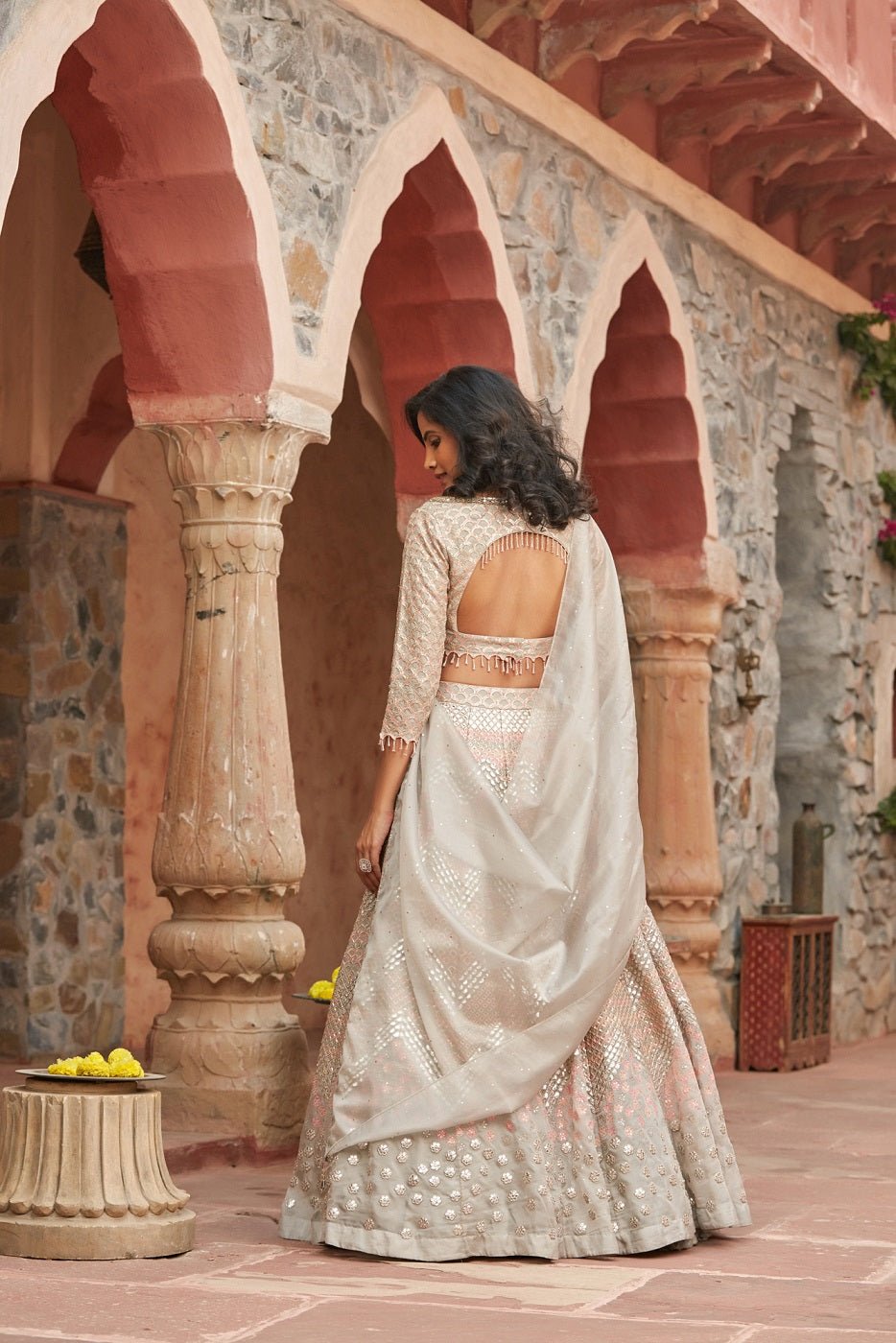 Buy stunning ivory embroidered organza lehenga online in USA with dupatta. Elevate your ethnic style with a tasteful collection of designer Anarkali, designer salwar suits, designer lehengas, sharara suits from Pure Elegance Indian clothing store in USA.-back