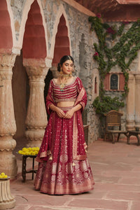 Shop beautiful maroon embroidered Banarasi lehenga online in USA with dupatta. Elevate your ethnic style with a tasteful collection of designer Anarkali, designer salwar suits, designer lehengas, sharara suits from Pure Elegance Indian clothing store in USA.-full view