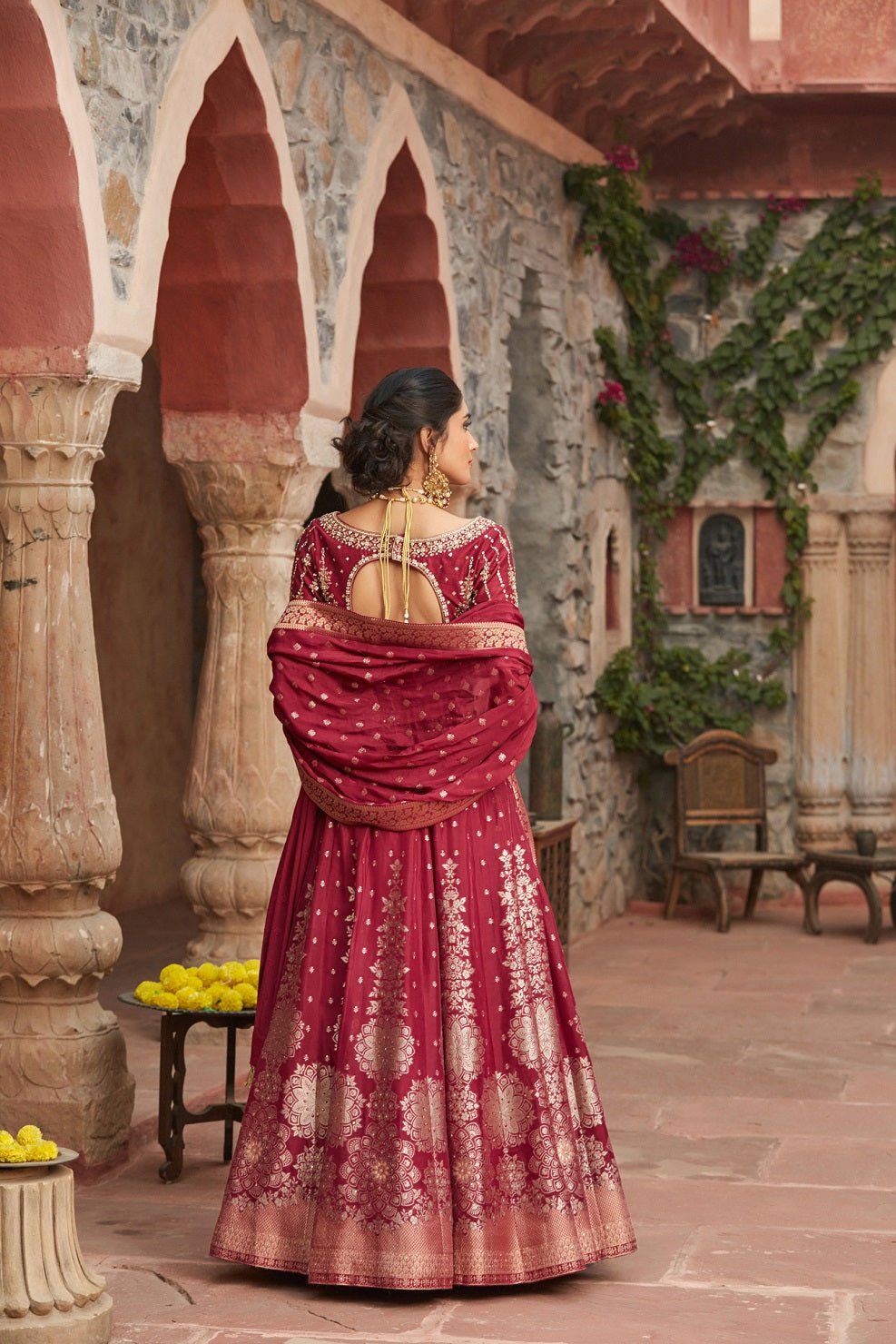Shop beautiful maroon embroidered Banarasi lehenga online in USA with dupatta. Elevate your ethnic style with a tasteful collection of designer Anarkali, designer salwar suits, designer lehengas, sharara suits from Pure Elegance Indian clothing store in USA.-back