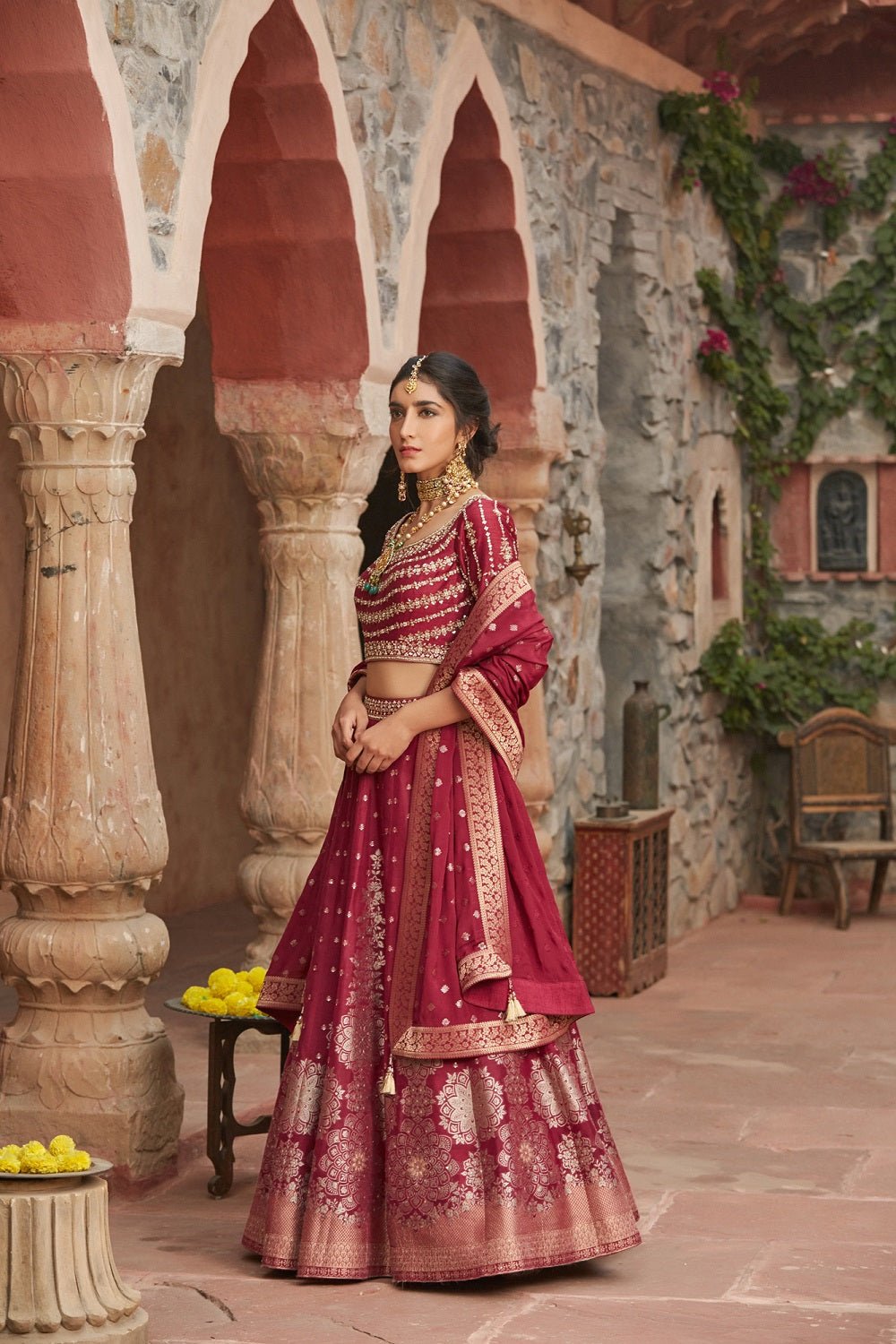 Shop beautiful maroon embroidered Banarasi lehenga online in USA with dupatta. Elevate your ethnic style with a tasteful collection of designer Anarkali, designer salwar suits, designer lehengas, sharara suits from Pure Elegance Indian clothing store in USA.-side